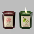 Rose And Apple Scented Candles In Red And Green Glass Jars With Labels