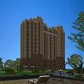 High Rise Residential Building With Beige Brown Exterior And Green Trees Lawns Under Blue Sky
