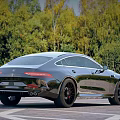 Luxury Mercedes AMG GT Coupe Silver Black Wheels on Road with Green Forest