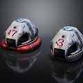Two Helmet Like Devices Featuring Number 17 And 3 White Red Reflective Design