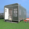 Green Trailer With Open Door Parked Near 4x4 Vehicle Folding Table Red Chairs On Grass