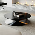 Modern Black Round Coffee Table In Living Room With Books And Cup Fireplace And Sofa