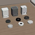 Various Robotic Vacuums With Different Colored Charging Stations On Wooden Floor