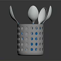 Stainless Steel Spoons In Perforated Metal Container With Blue Dots On Dark Background