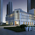 Modern Commercial Complex With Glass Facade And Plaza Surrounded By High-Rise Buildings