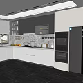 Modern Kitchen Interior With Gray White Cabinets Built In Ovens And Marble Countertop
