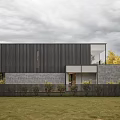 Modern Forest House With Large Glass Windows Black Exterior And Natural Surroundings