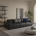 Black Leather Three Seater Sofa with Checkered and Blue Cushions in Living Room with Artwork