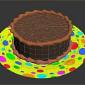 Delicious Chocolate Cake With Red Frosting Border On Colorful Polka Dot Plate