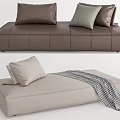 Modern Brown And Beige Sectional Sofa With Decorative Pillows And Throw Blanket