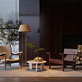 Modern Lounge Chairs in Interior Space With Round Coffee Table Floor Lamp and Green Plants