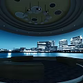 Modern Cinema Interior With Circular Design Sofa Seats Ceiling Lights And City Night View