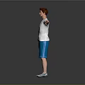 Man With Red Hair White T-Shirt Blue Shorts Arms Outstretched Against Gray Background Wearing Sneakers