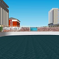 Red Multi Story Building With Circular Pool And Surrounding Structures Under Blue Sky