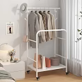White Mobile Clothes Rack With Wheels Coats Hats Bags And Storage Boxes In Bedroom Setting