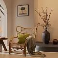 Rattan Leisure Chair Featuring Green Cushion Blanket And Side Table With Lamp Near Decorative Painting