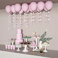 Decorative Ornaments Set with Pink Balloons Star Decorations Dessert Stands Layered Cake and Green Plants