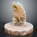 Natural Honeycomb Structure Placed On Round Stone Base With Golden Honey