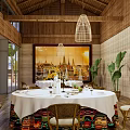 Elegant Private Dining Room With Wooden Ceiling Cage Chandeliers Decorative Paintings And White Tablecloths
