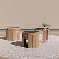 Three Wooden Round Side Tables On Woven Rug With Small Plant