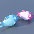 Blue And Pink Fish Shaped Toys With Star And Polka Dot Patterns And Eyes
