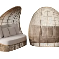 Pair of Egg Shaped Woven Rattan Leisure Chairs with Light Colored Cushions and Pillows