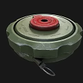 Green Circular Military Mine With Red Top Cover And Metal Ring Structure