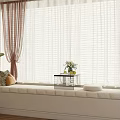 Bay Window Alcove With White Blinds Cushioned Seat Decorative Pillows Brown Curtains And Potted Plant