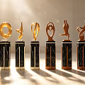 Decorative Ornament Set With Golden Sculptural Designs And Black Marble Bases