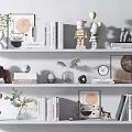 Decorative Ornament Combinations on White Shelves with Statues Books Frames Plants Clock and Vases