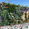 Living Green Wall With Diverse Plants Colorful Flowers Pebble Ground And Wooden Backdrop