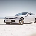 Colorful Sports Cars Parked On Sandy Beach With Mountain Background