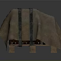 Household Item Covered With Brown Fabric And Cross Tied Black Straps On Wooden Pallet