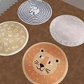 Colorful Round Rugs With Lion Face Alphabet And Spiral Patterns On Wooden Floor