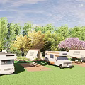 Scenic Campsite With RVs Tents Green Grass And Trees Under Blue Sky