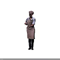 Woman in Brown Apron with Bow Holding Spatula Preparing Meal in Kitchen