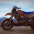 KTM Blue And Orange Muddy Off Road Motorcycle On Mountain Landscape