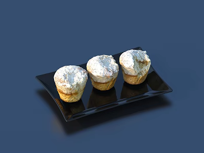 Freshly Baked Three Muffins Topped With White Powdered Sugar On Black Plate 3d model