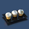 Freshly Baked Three Muffins Topped With White Powdered Sugar On Black Plate