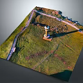 Ancient Historical Site With Tower Structure And Winding Pathway On Green Grassland