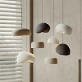 Modern Minimalist Pendant Lights With Organic Pebble Shapes In Neutral Tones And Window Blinds