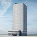 Modern White High Rise Office Building With Glass Base Against Blue Sky