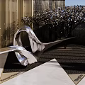 Modern Garden Ornament With Metallic Curved Sculpture Flowering Trees And Geometric Paving Design
