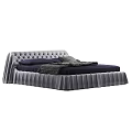 Modern Tufted Bed With Pleated Skirt And Navy Bedding