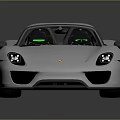 Silver Sleek Sports Car With Green Alloy Wheels On Reflective Surface