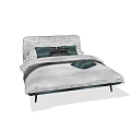 Double Bed With Gray Velvet Headboard Dark Green Pillows And Light Gray Bedding
