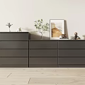 Gray Chest of Drawers on Light Wooden Floor with Green Plants Decorations and Wall Art