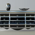 Modern Console Cabinet with Black Drawers and Silver Frame Decorative Vase and Bowl on Top