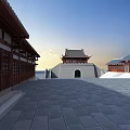 Traditional Chinese Ancient City Gate Tower With Stone Archway And Open Square Area