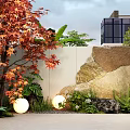 Garden Landscape Design With Red Maple Tree White Wall Rock Round Lights And Green Plants